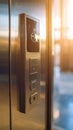 Close-up of elevator control panel with buttons and keyhole, metallic finish Royalty Free Stock Photo