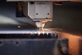 close-up of a laser cutter cutting through metal sheet Royalty Free Stock Photo