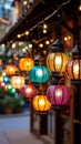 Colorful Moroccan Lanterns Hanging Outdoors at Dusk with Bokeh Lights Royalty Free Stock Photo