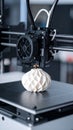3D printer printing a white geometric object close up Royalty Free Stock Photo