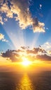 Dramatic sunset over ocean with sun rays breaking through clouds Royalty Free Stock Photo