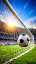 Dynamic soccer ball caught in the goal net at a vibrant stadium with bright sun Royalty Free Stock Photo