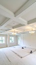 Empty interior room with coffered ceiling and chandeliers, ready for renovation Royalty Free Stock Photo