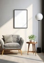 Empty vertical frame for wall art mockup. Modern living room with grey chair and table.