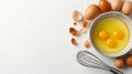 Fresh cracked eggs in ceramic bowl flour, shells, and whole brown eggs placed on clean white table Royalty Free Stock Photo