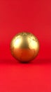 Golden Globe on Red Backdrop Showing Continents World Map Planet Earth Royalty Free Stock Photo