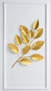 Golden leaf branch on white wall with molding, metallic design, decorative art Royalty Free Stock Photo