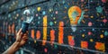 A hand holding a lit light bulb against a wall with colorful graffiti. created by generative artificial intelligence Royalty Free Stock Photo
