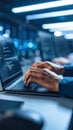 Hands typing on laptop with code in a data center, technology concept. Royalty Free Stock Photo