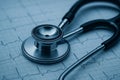 Stethoscope on ECG Heart Rhythm Chart â Blue-Toned Medical Diagnostic Close-Up Royalty Free Stock Photo
