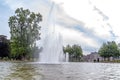 The large fountain during a beautiful but windy day in the gardens of Paleis het Loo in Apeldoorn, Netherlands Royalty Free Stock Photo