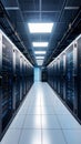 Modern datacenter aisle with rows of server racks glowing with lights and ceiling cables Royalty Free Stock Photo