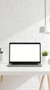 Modern Laptop with Blank Screen on White Desk Brick Wall Background Royalty Free Stock Photo