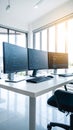 Modern office workspace with multiple computer monitors displaying code and data Royalty Free Stock Photo
