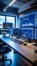 Modern office workspace with multiple computer screens displaying financial data and charts Royalty Free Stock Photo