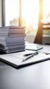 Office desk with paperwork, pen, and documents in bright sunlight Royalty Free Stock Photo