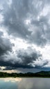Ominous Storm Clouds over Reflective Lake Landscape Royalty Free Stock Photo