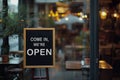 open sign Restaurant door handle with push sign on glass doors.