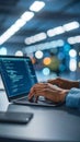Person working on laptop with code, hands typing, technology concept, blurred background Royalty Free Stock Photo