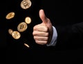 A confident thumbs-up with floating Bitcoin coins symbolizes trust, innovation, and progress in the crypto world.