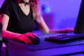 Focused Professional Gamer Playing in a Vibrant Gaming Room