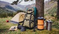 Realistic hiking backpack set up at a campsite with mountain and forest on background. Camping scene. AI Generated. AI Royalty Free Stock Photo