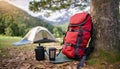 Realistic hiking red backpack set up at a campsite with mountain and forest. Camping scene. AI Generated. AI Generative Royalty Free Stock Photo