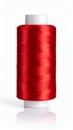 Red thread spool with reflection on white background, sewing supplies concept. Royalty Free Stock Photo