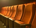 Generated image. A row of seats in an empty theater. Royalty Free Stock Photo