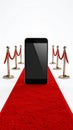 Smartphone on Red Carpet VIP Treatment Luxurious Mobile App Launch Royalty Free Stock Photo