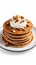 Stack of Pancakes with Whipped Cream and Hazelnuts on a White Plate Royalty Free Stock Photo