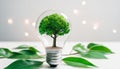 tree growing inside a light bulb. Concept of green energy and energy-saving light bulbs Royalty Free Stock Photo