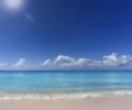 Tropical Beach Scene with sun and clouds and negative space Royalty Free Stock Photo