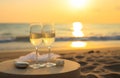 Two glasses of wine on beach table Royalty Free Stock Photo