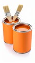 Two open cans of orange paint with brushes for a home renovation project. Royalty Free Stock Photo