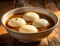 A South Indian dish of Idli Sambar, served in a clay bowl. Generated image Royalty Free Stock Photo