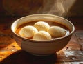 A South Indian dish of Idli Sambar, served in a clay bowl. Generated image Royalty Free Stock Photo