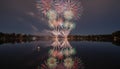 Spectacular Fireworks Reflected in Calm Lake at Night Royalty Free Stock Photo