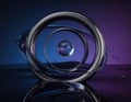 Chrome metal torus with gravitationally impossible liquid flow, glass sphere with ray-traced reflections Generated image Royalty Free Stock Photo