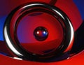 Chrome metal torus with gravitationally impossible liquid flow, glass sphere with ray-traced reflections Generated image Royalty Free Stock Photo