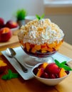 Vanilla peach dessert or melba ice cream with peach fruits. Colorful assortment of fruit salad topped with whipped cream Royalty Free Stock Photo