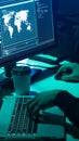 Wanted hackers coding virus ransomware using laptops and computers. Cyber attack, system breaking and malware concept.
