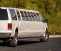 Side view of a white stretch limousine with multiple tinted windows Royalty Free Stock Photo
