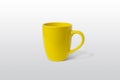 Yellow cup on gray surface for logo branding mockup Royalty Free Stock Photo