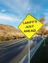 Yellow roadside warning sign warning of tariffs just ahead Royalty Free Stock Photo