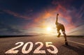 Young man running and sprinting on road with 2025 new year concept Royalty Free Stock Photo