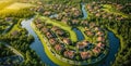 Aerial view of a lush, green planned residential community with winding roads, housing estates, sports fields, and water