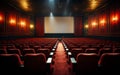 Empty cinema theater with red seats curtains and a blank white screen ready for the audience to enjoy a movie