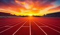 Empty Running Track in Stadium with Vibrant Sunset Sky Inviting Atmosphere for Sports and Athletics Royalty Free Stock Photo