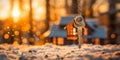 Golden winter sunrise illuminates a house-shaped key evoking the warmth of a cozy home amidst a snowy landscape symbolizing Royalty Free Stock Photo